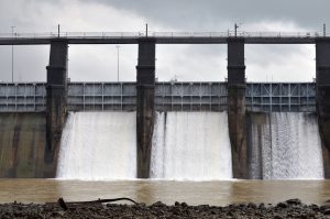 Water,Management,Floodgates,Release,Water,Beneath,A,Dam,Creating,Waterfall.