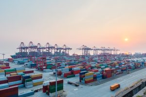 Shanghai,Port,At,Dusk,,Container,Terminal,With,Global,Trade,Background