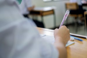 Concentration,Of,Student,Reading,Document,Test,Papers,And,Taking,Exam