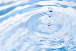 Water,Drops,Falling,On,Water,Surface.